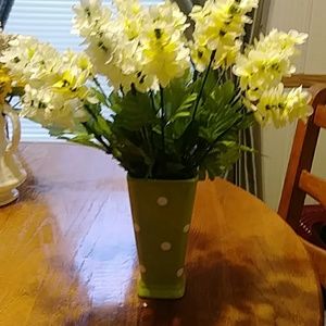 Green polka dot vase with white arrangement